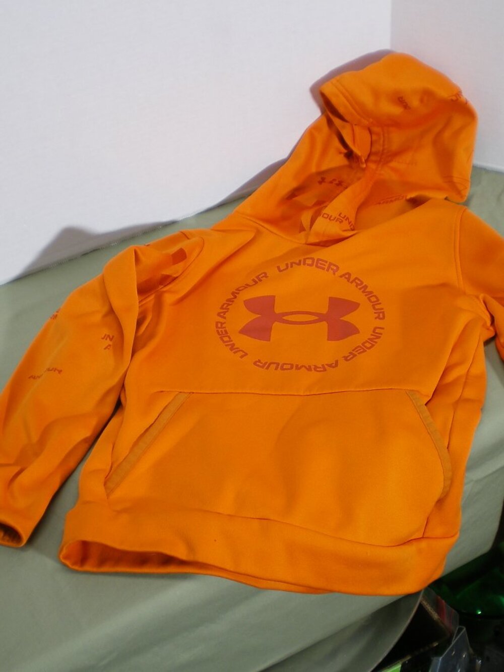 Under Armour Bright Orange Fleece Hoodie, Size Youth Small.